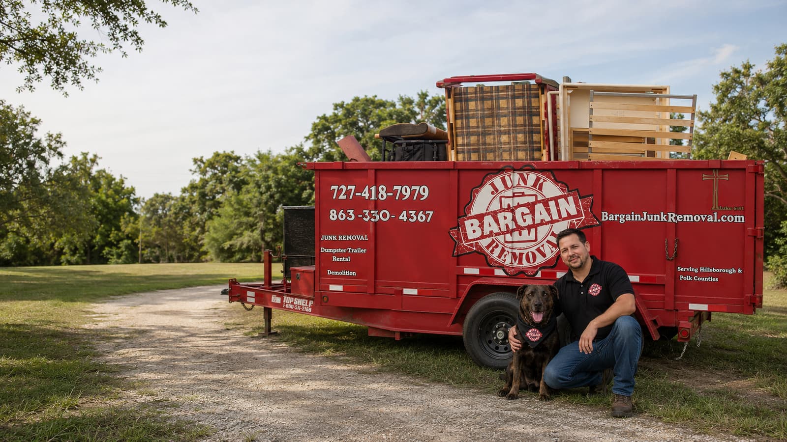 Nick and his dog beside the loaded red Bargain Junk Removal trailer in Lakeland, FL